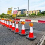 alt="road closed with traffic cones"