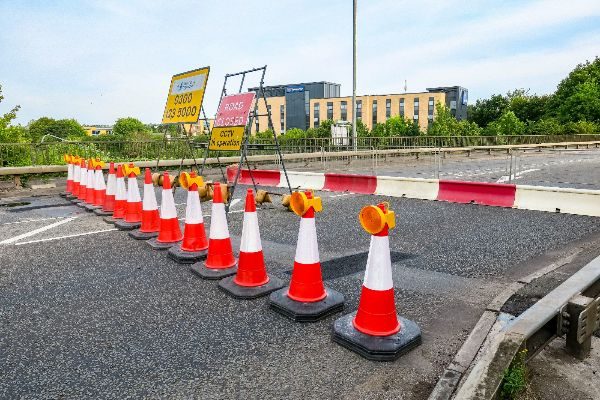alt="road closed with traffic cones"